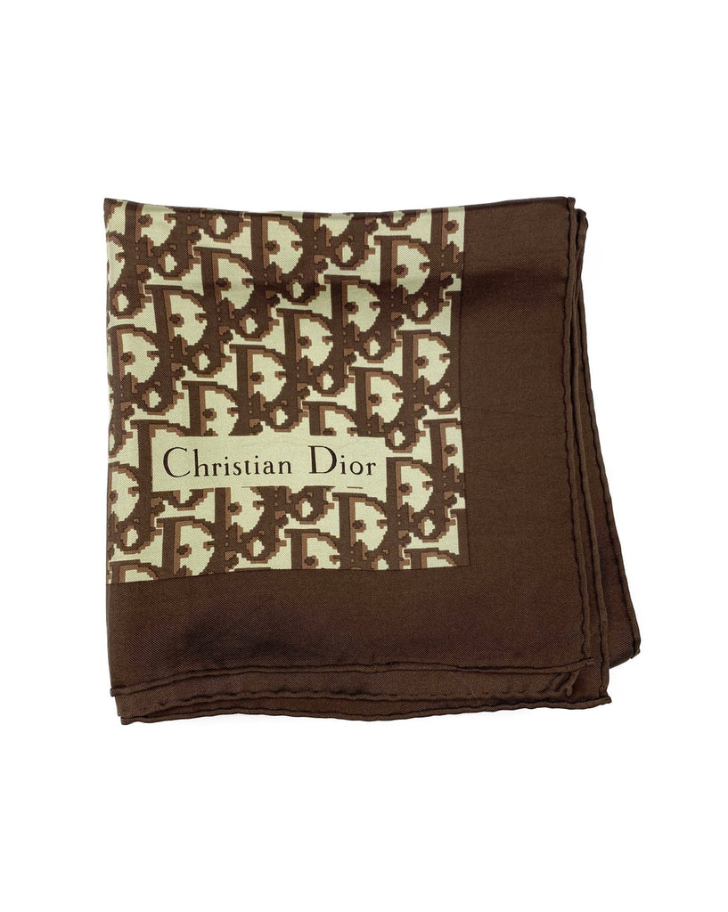 Fruit Vintage Christian Dior oblique print silk scarf in brown. Features a bold graphic Dior logo print and hand finished rolled hem edging.