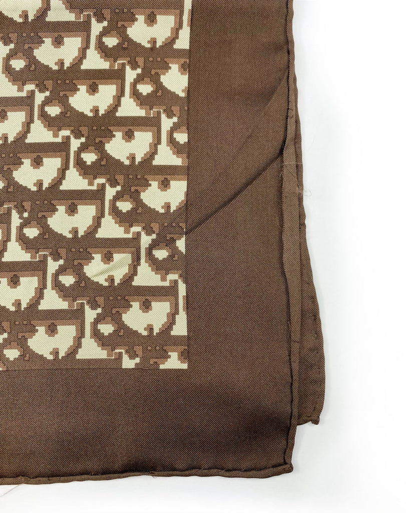 Fruit Vintage Christian Dior oblique print silk scarf in brown. Features a bold graphic Dior logo print and hand finished rolled hem edging.