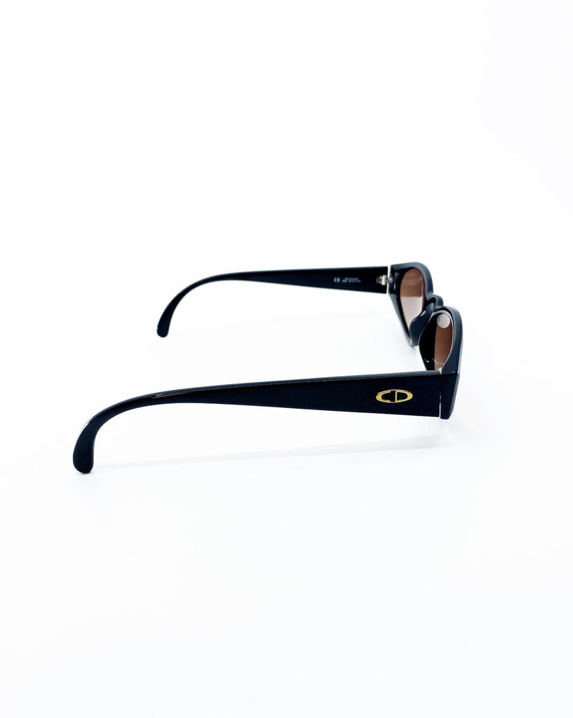 Fruit Vintage Christian Dior sunglasses dating to 1990. These small oval frames feature a gold trim over the nose and CD logo to each arm.
