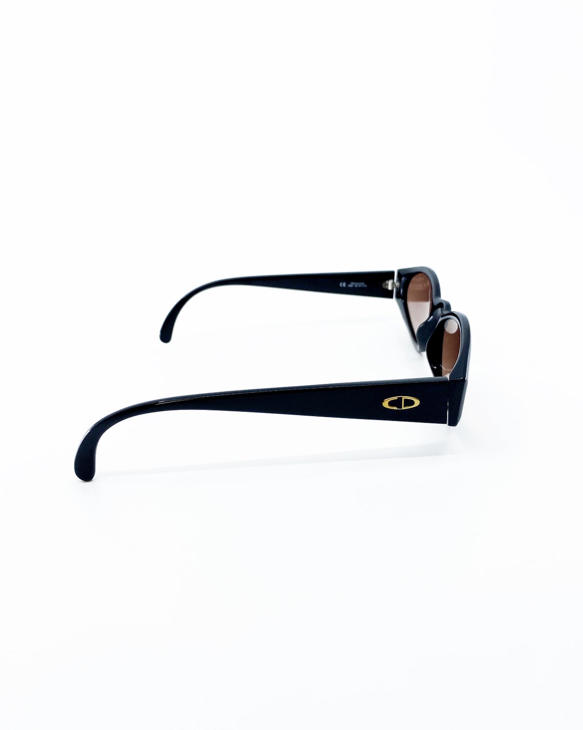Fruit Vintage Christian Dior sunglasses dating to 1990. These small oval frames feature a gold trim over the nose and CD logo to each arm.