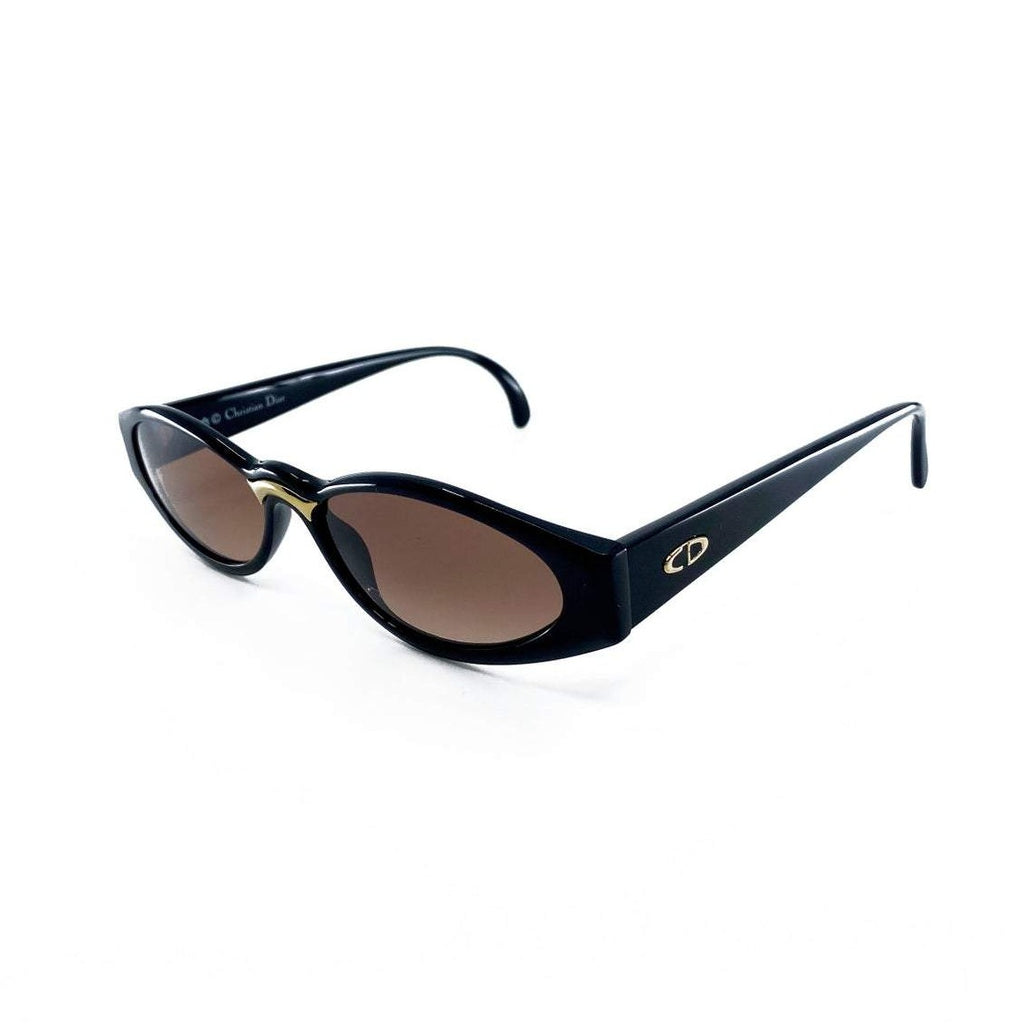 Fruit Vintage Christian Dior sunglasses dating to 1990. These small oval frames feature a gold trim over the nose and CD logo to each arm.