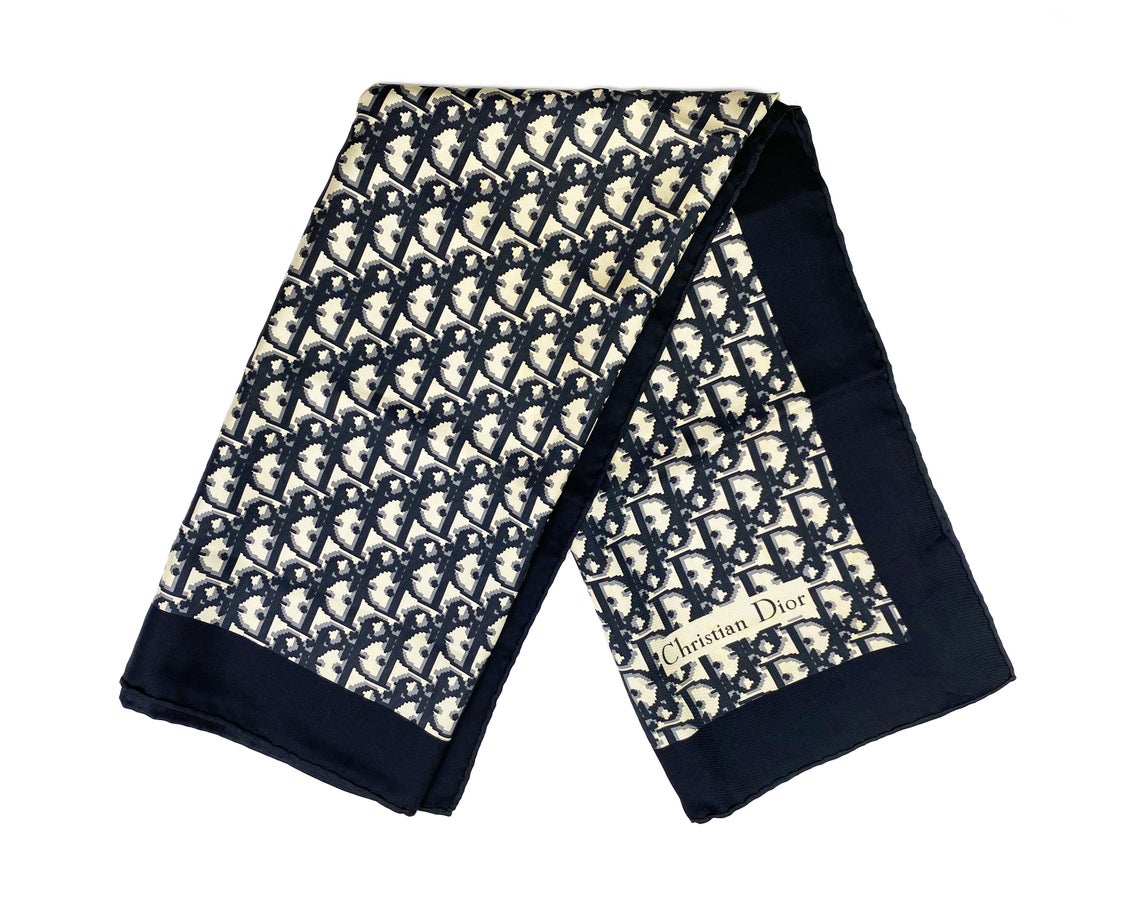 Fruit Vintage Christian Dior oblique print silk scarf in black and grey. Features a bold graphic Dior logo print and hand finished rolled hem edging.