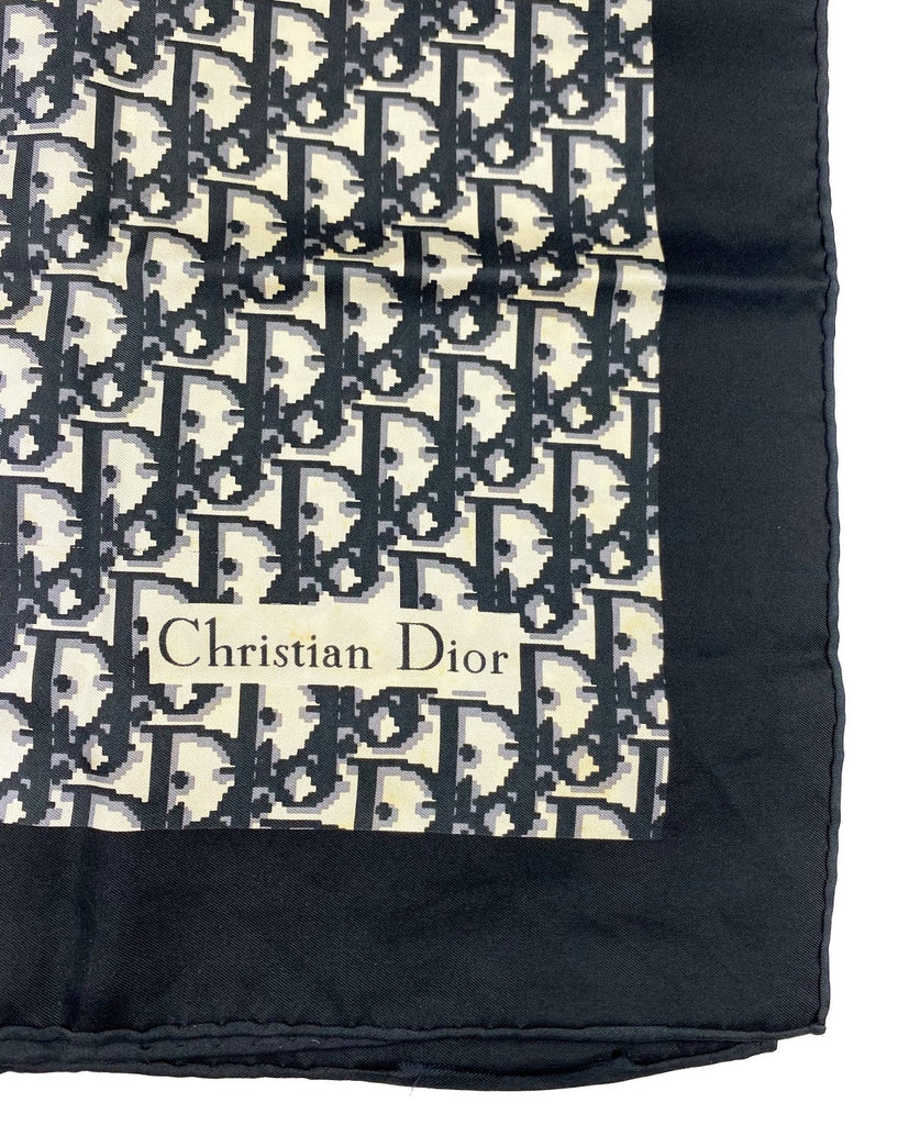 Fruit Vintage Christian Dior oblique print silk scarf in black and grey. Features a bold graphic Dior logo print and hand finished rolled hem edging.