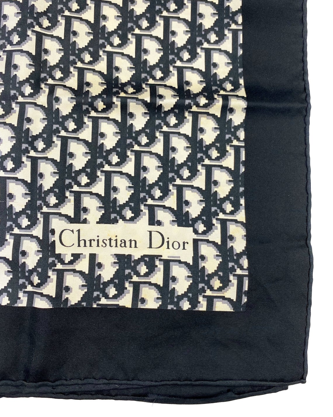 Fruit Vintage Christian Dior oblique print silk scarf in black and grey. Features a bold graphic Dior logo print and hand finished rolled hem edging.