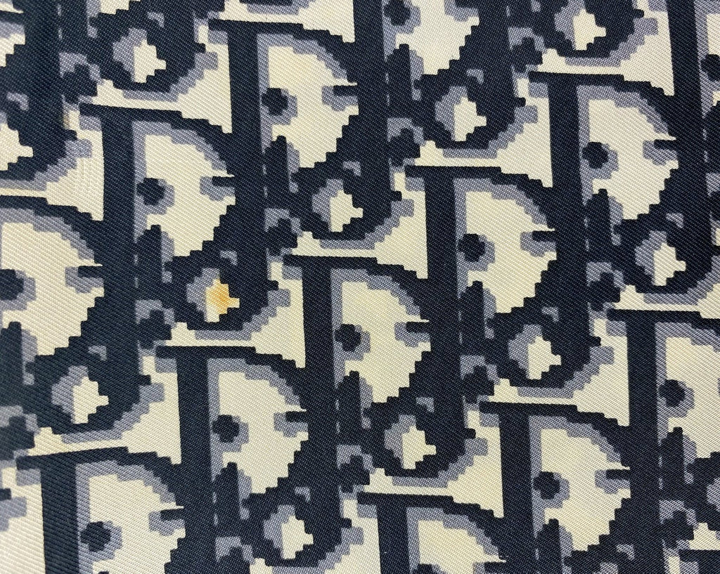 Fruit Vintage Christian Dior oblique print silk scarf in black and grey. Features a bold graphic Dior logo print and hand finished rolled hem edging.