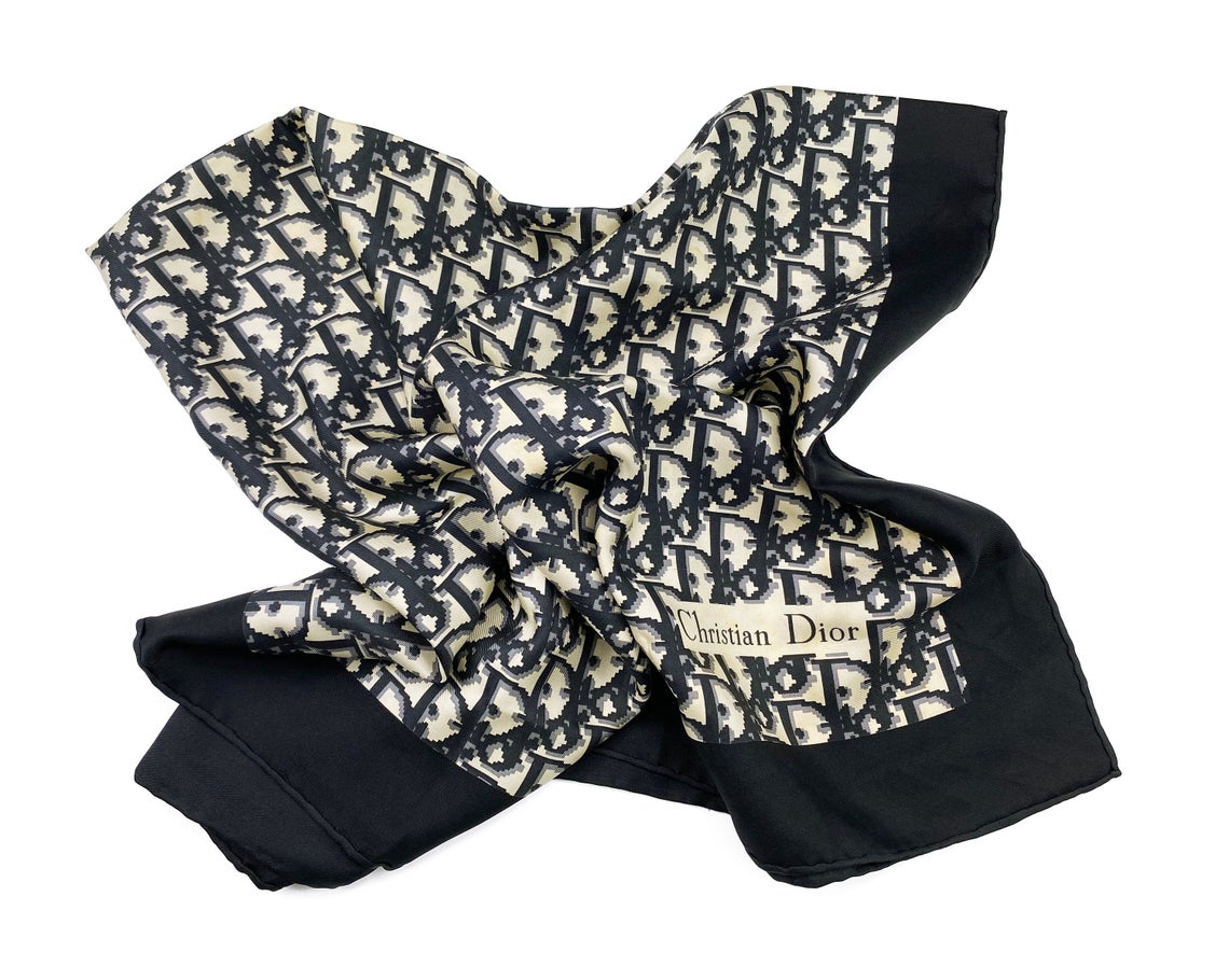 Fruit Vintage Christian Dior oblique print silk scarf in black and grey. Features a bold graphic Dior logo print and hand finished rolled hem edging.
