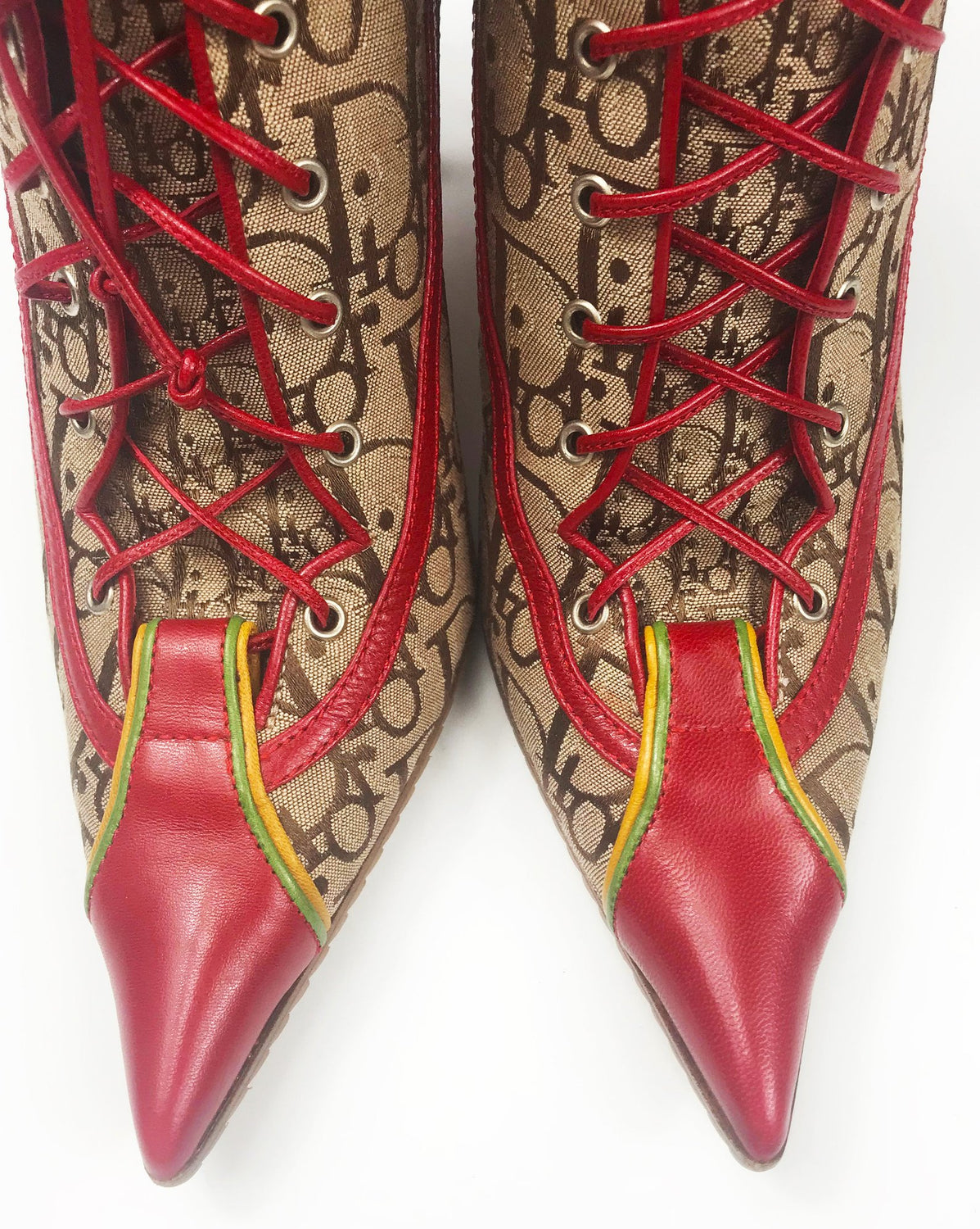 Fruit Vintage Christian Dior Rasta ankle boots, trotter monogram logo booties. Designed by John Galliano, they feature oblique logo print, lace up closure with leather laces, red leather trim and a large silver logo plate at rear.
