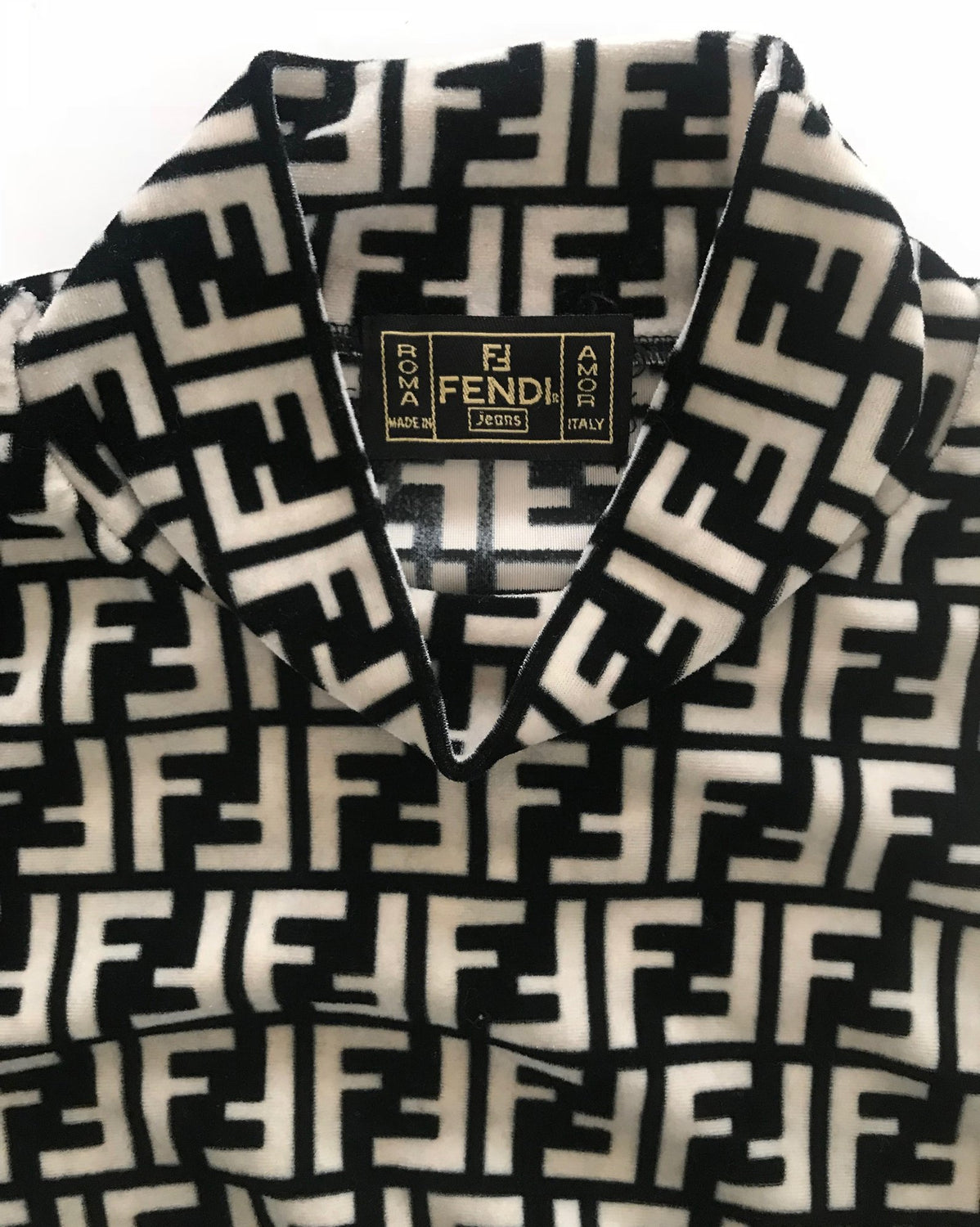 FRUIT vintage Fendi 90s Zucca Logo Monogram Print turtleneck sweater made from stretch velvet fabric. Features a classic turtleneck cut and bold Fendi logo print in black and beige as seen on Sofia Richie.