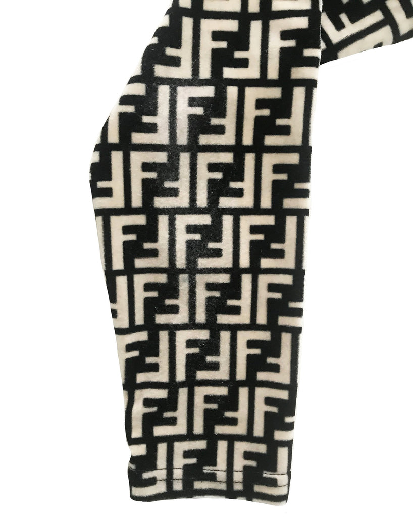 FRUIT vintage Fendi 90s Zucca Logo Monogram Print turtleneck sweater made from stretch velvet fabric. Features a classic turtleneck cut and bold Fendi logo print in black and beige as seen on Sofia Richie.