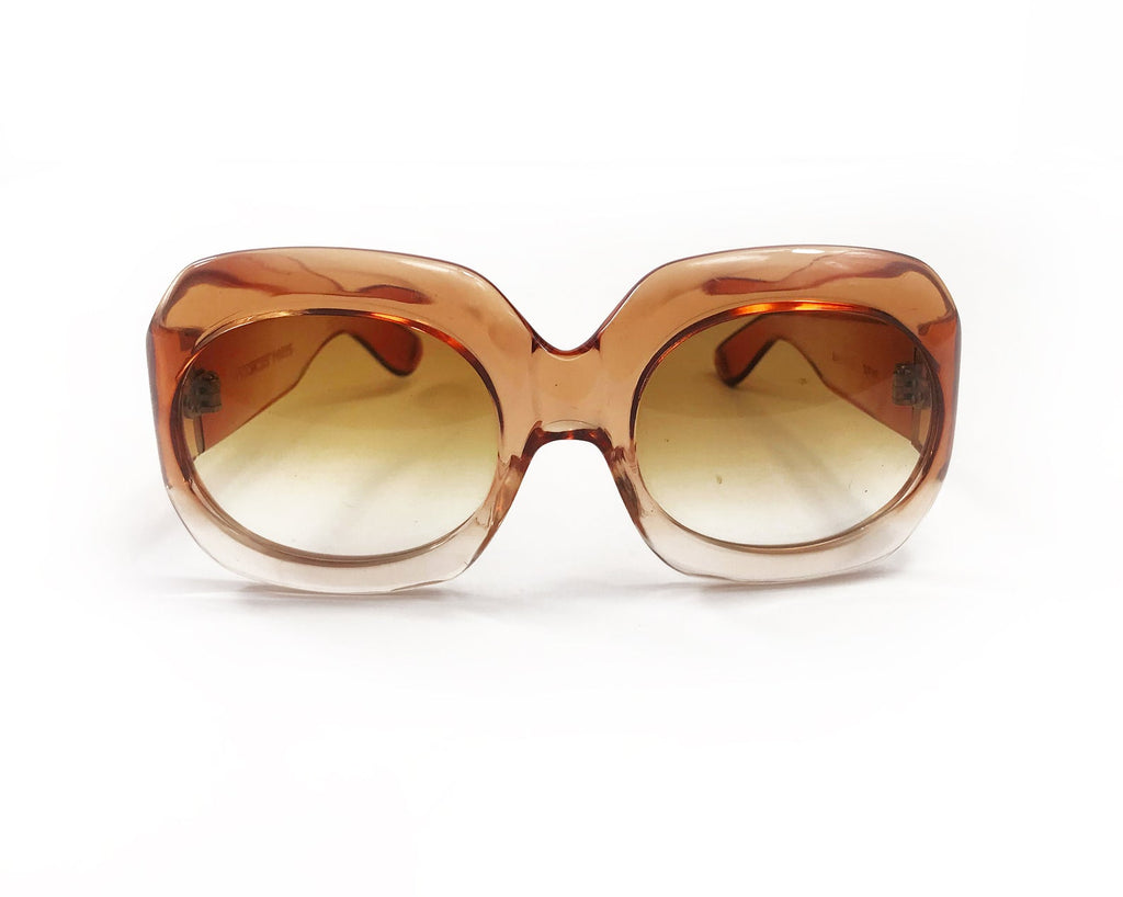 Fruit Vintage Givenchy Paris oversized vintage sunglasses dating to the 1970s. Comes with original suede case. Hand made, they feature Givenchy G logos on each arm and brown ombre lenses.