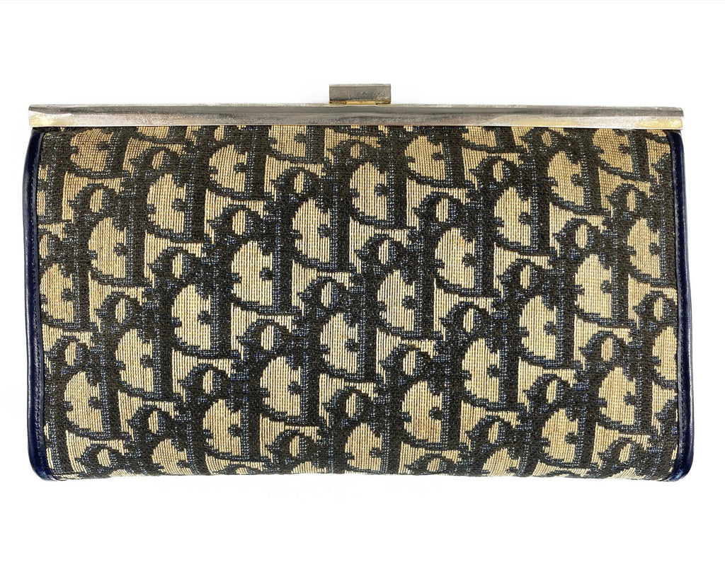 Fruit Vintage 1970s Christian Dior clutch bag with navy logo print canvas and featuring the iconic Dior 70's CD logo and gold hardware clip top closure