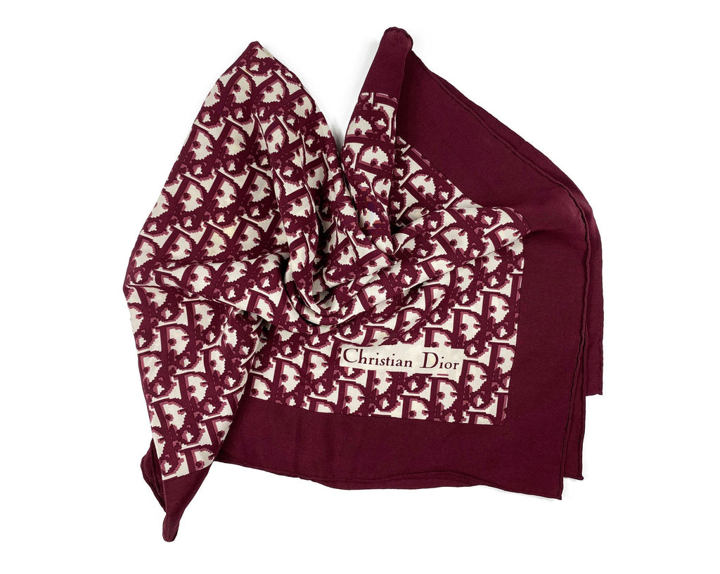 Fruit Vintage Christian Dior oblique print silk scarf, perfect for use as a hair accessory, to tie around a hat or even wear as a handkerchief top. Features a bold graphic Dior logo print and hand finished rolled hem edging.