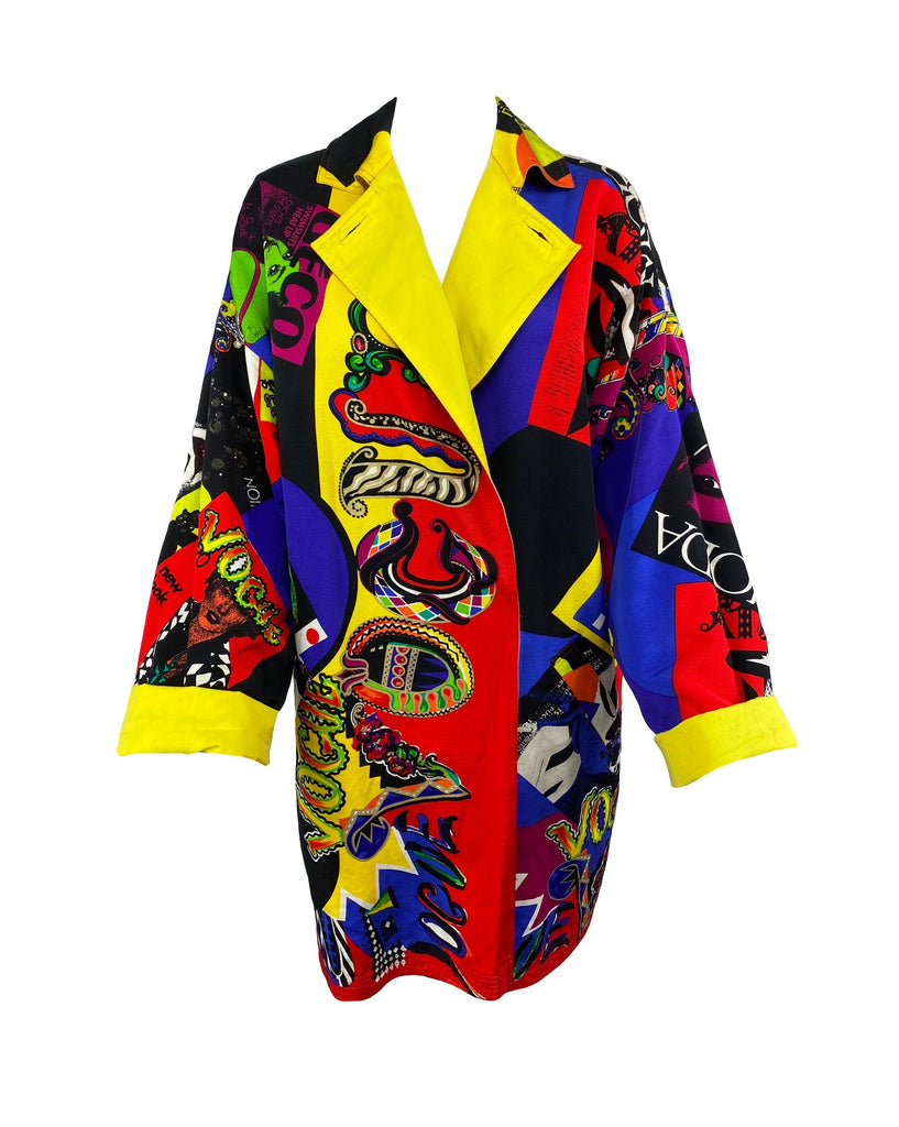 FRUIT Vintage Gianni Versace Vogue print coat from the iconic Spring 1991 runway collection. It features the iconic Vogue print in large scale all over and is fully reversible with a yellow cotton lining. This coat is a true piece of fashion history!