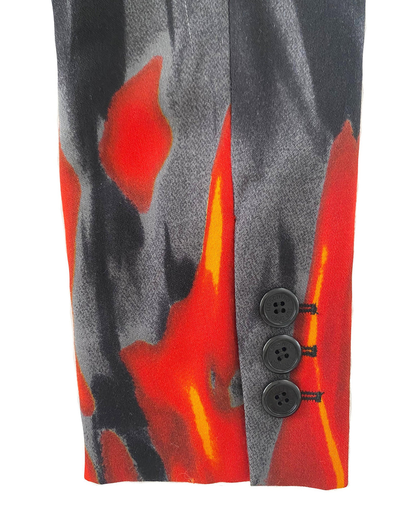 FRUIT Vintage Moschino 90s Flame Jacket as worn by Fran Drescher on the Nanny! It features a flame and smoke print on the hem line and sleeves going up the jacket.