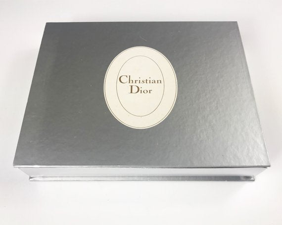 FRUIT Vintage Christian Dior very rare porcelain change tray featuring the 1980s logo in the center surrounded by vibrant green and blue tones and floral motifs.