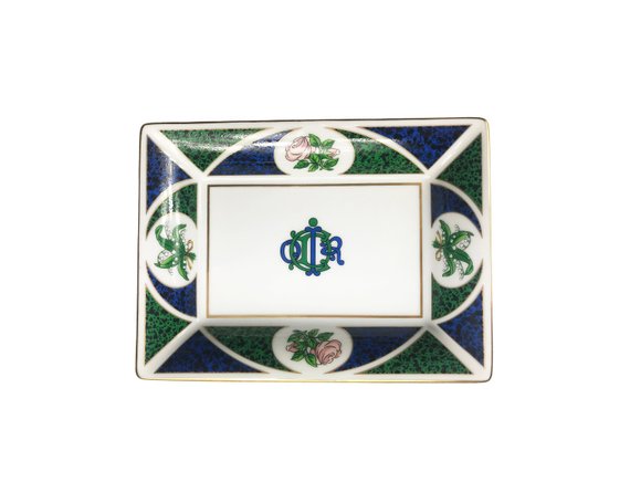 FRUIT Vintage Christian Dior very rare porcelain change tray featuring the 1980s logo in the center surrounded by vibrant green and blue tones and floral motifs.