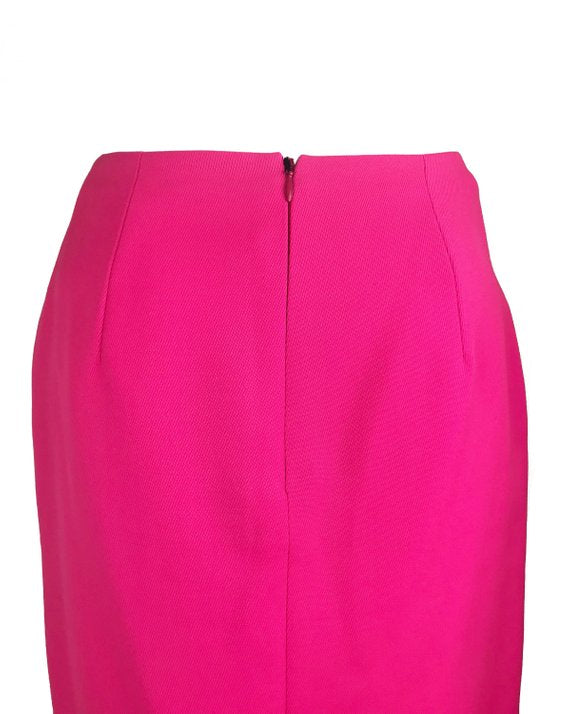 FRUIT Vintage neon pink lifetime Gianni Versace skirt with the original tags still attached. This piece dates to 1996 and features a classic slim fit and high waist design.