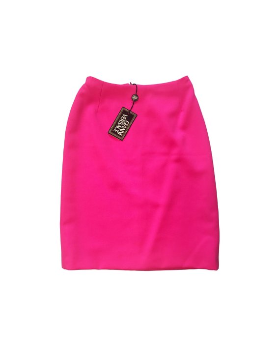 FRUIT Vintage neon pink lifetime Gianni Versace skirt with the original tags still attached. This piece dates to 1996 and features a classic slim fit and high waist design.