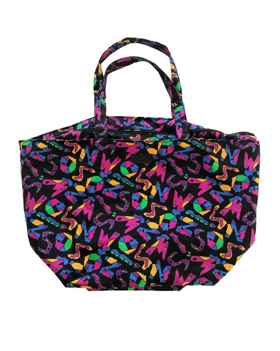 Fruit Vintage 1980s Missoni beach bag in a psychedelic logo printed nylon fabric. Features a zipper closure at top and internal zipped pocket.