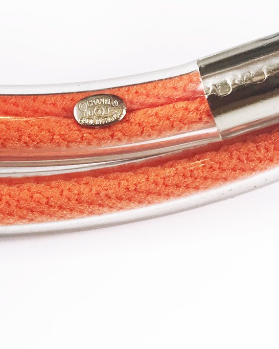Fruit Vintage Chanel orange wrap around rubber tubing choker with CHANEL text logo all around.