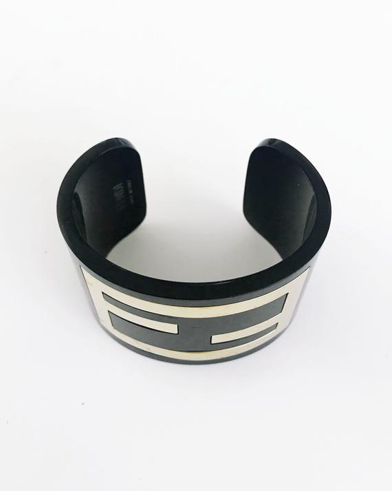 FRUIT Vintage Fendi Zucca Monogram Logo Cuff Bracelet. Featuring large brass Fendi logo F's set in black perspex.