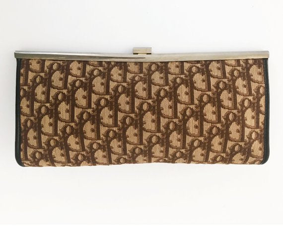 FRUIT vintage 1970s Christian Dior clutch bag is made of Brown oblique monogram logo trotter print canvas and features a gold hardware clip top closure.
