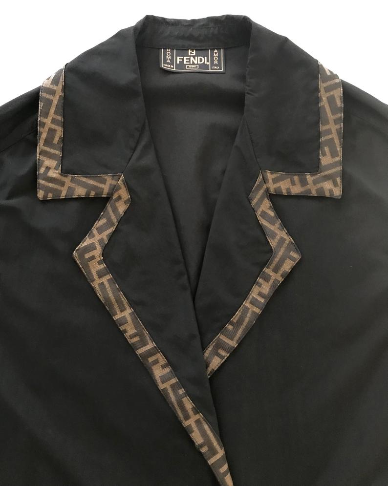 FRUIT Vintage Fendi 1990s oversized cocoon coat with iconic Zucca logo print trim.