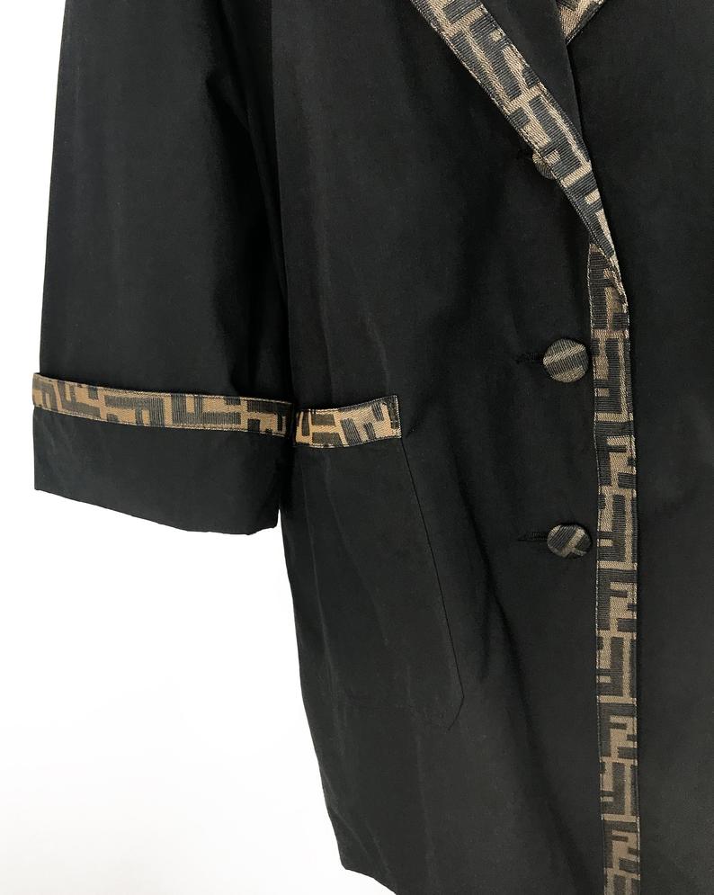 FRUIT Vintage Fendi 1990s oversized cocoon coat with iconic Zucca logo print trim.