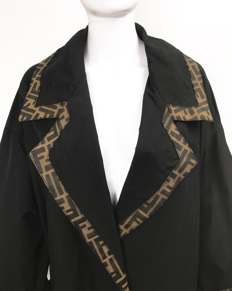 FRUIT Vintage Fendi 1990s oversized cocoon coat with iconic Zucca logo print trim.