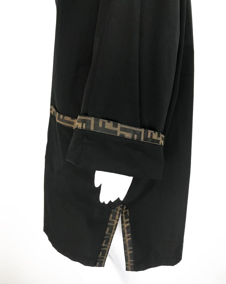 FRUIT Vintage Fendi 1990s oversized cocoon coat with iconic Zucca logo print trim.