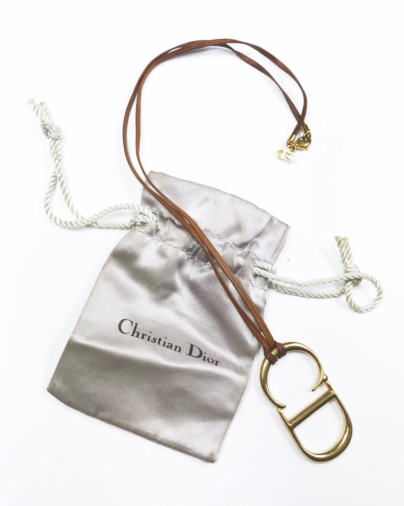 Fruit Vintage Christian Dior CD logo monogram pendant necklace on leather strap.