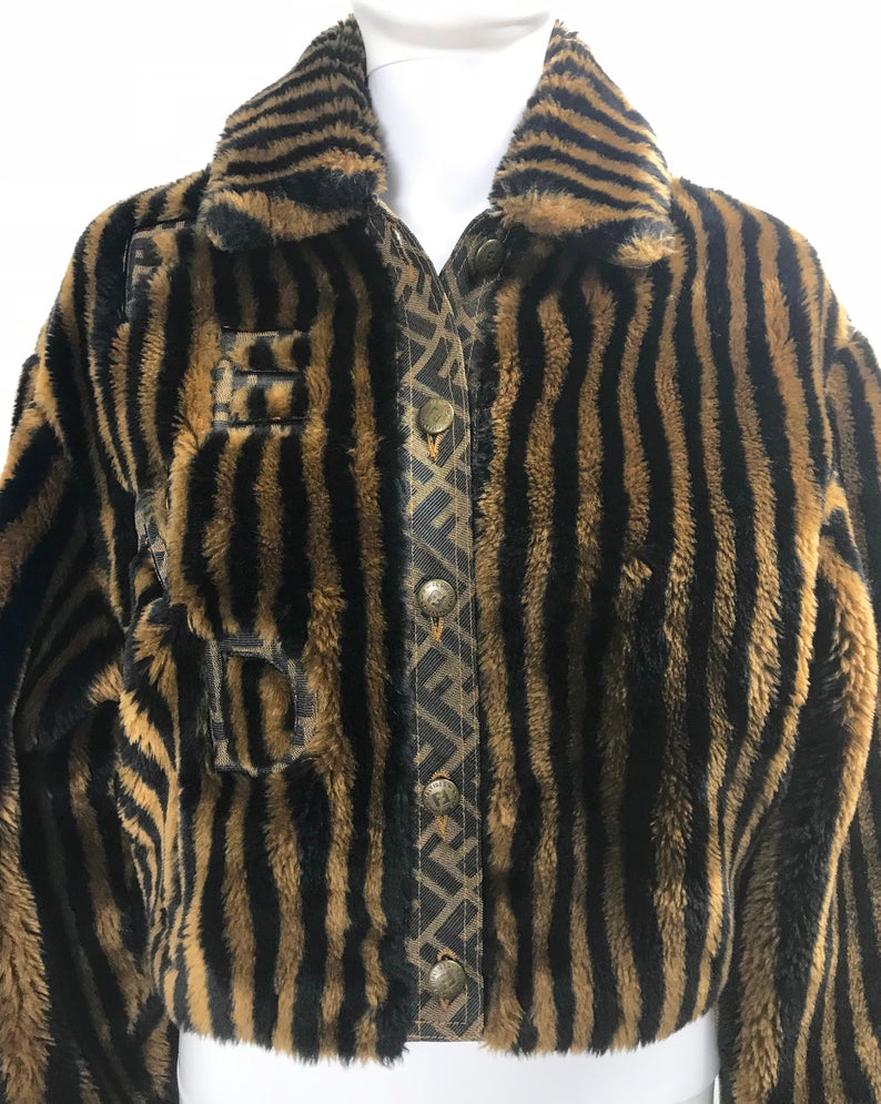 FRUIT Vintage Fendi faux fur stripe bomber jacket dating to 1995. It features the classic Zucca logo trim and embroidered Zucca print Fendi letters, as worn by Mary J Blige