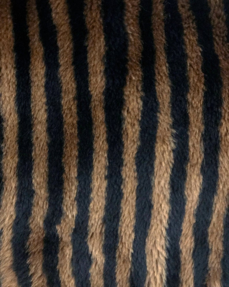 FRUIT Vintage Fendi faux fur stripe bomber jacket dating to 1995. It features the classic Zucca logo trim and embroidered Zucca print Fendi letters, as worn by Mary J Blige