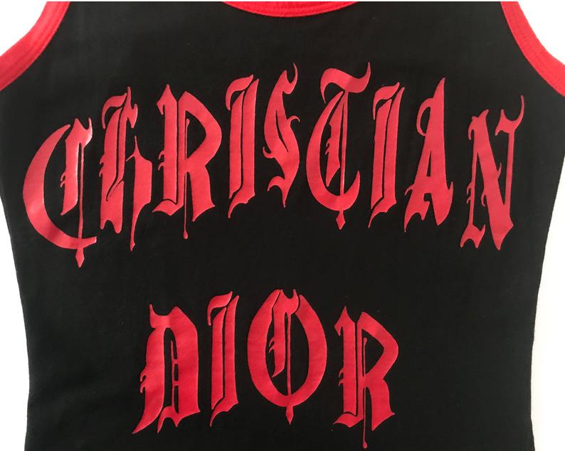 Fruit Vintage Christian Dior tank designed by John Galliano with Gothic text Logo. Features a classic racer tank cut and graphic print with Christian Dior across the front and 1947 across the back