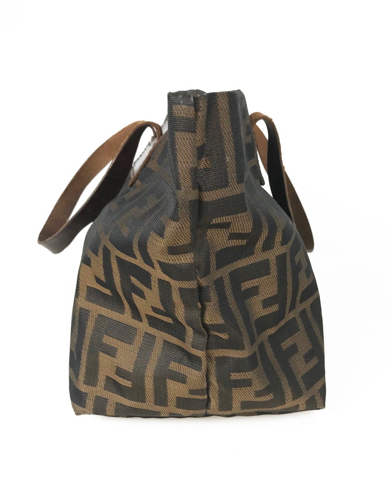 FRUIT Vintage Fendi Zucca mini small logo tote bag in the classic Fendi Zucca canvas. It features leather handles and trim (its can be folded into a small square for travel!)