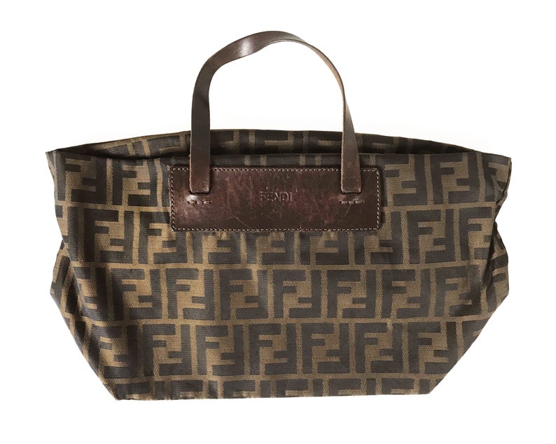 FRUIT Vintage Fendi Zucca mini small logo tote bag in the classic Fendi Zucca canvas. It features leather handles and trim (its can be folded into a small square for travel!)