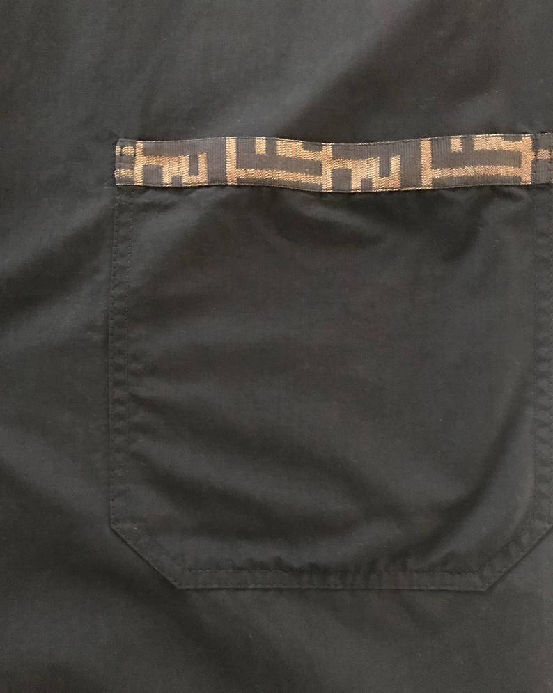 FRUIT Vintage Fendi 1990s oversized cocoon coat with iconic Zucca logo print trim.