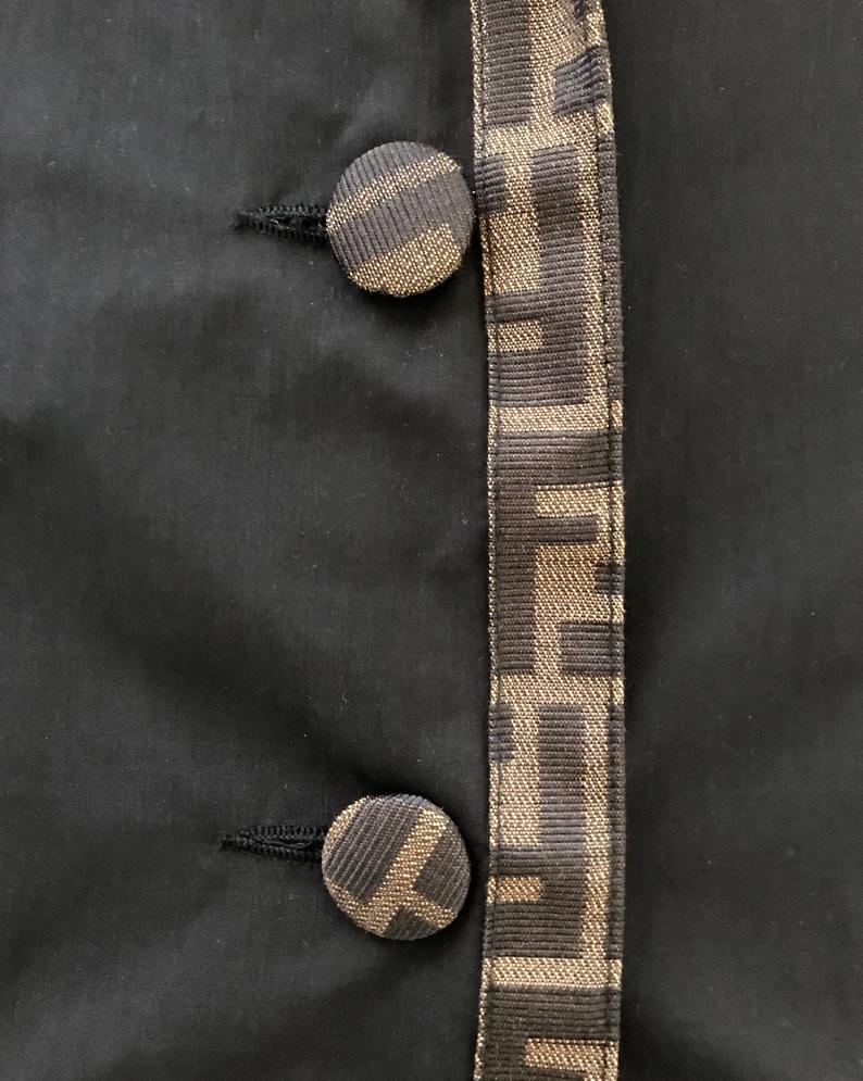 FRUIT Vintage Fendi 1990s oversized cocoon coat with iconic Zucca logo print trim.