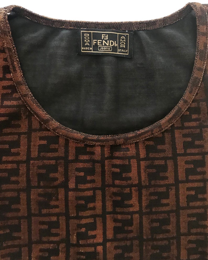 FRUIT vintage Fendi Zucca print t-shirt dating to the 90s, made from the cutest metallic effect sheen fabric which changes colour in light. Features a classic t-shirt cut and semi-transparent mesh style fabric.