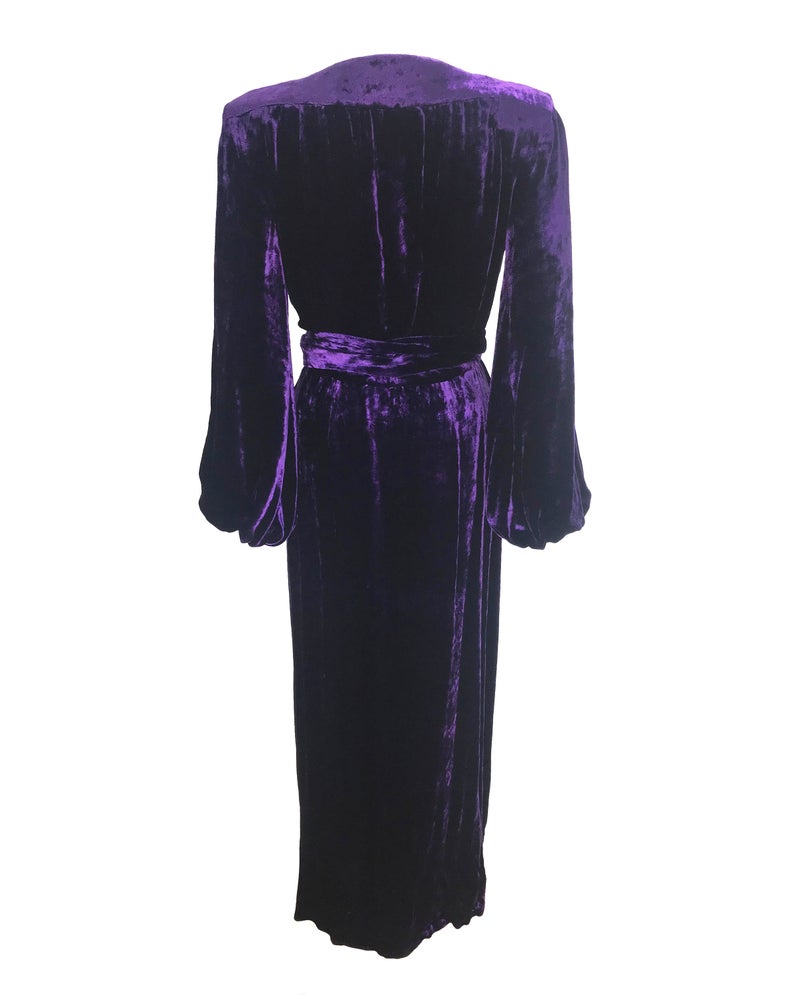 FRUIT Vintage Yves Saint Laurent Rive Gauche purple velvet gown dating to the 1970s. YSL dress features a plunging neckline, gorgeous 70s bell sleeves and removable wrap tie belt. It can be worn as a dress or unclipped and worn as a duster jacket/robe.