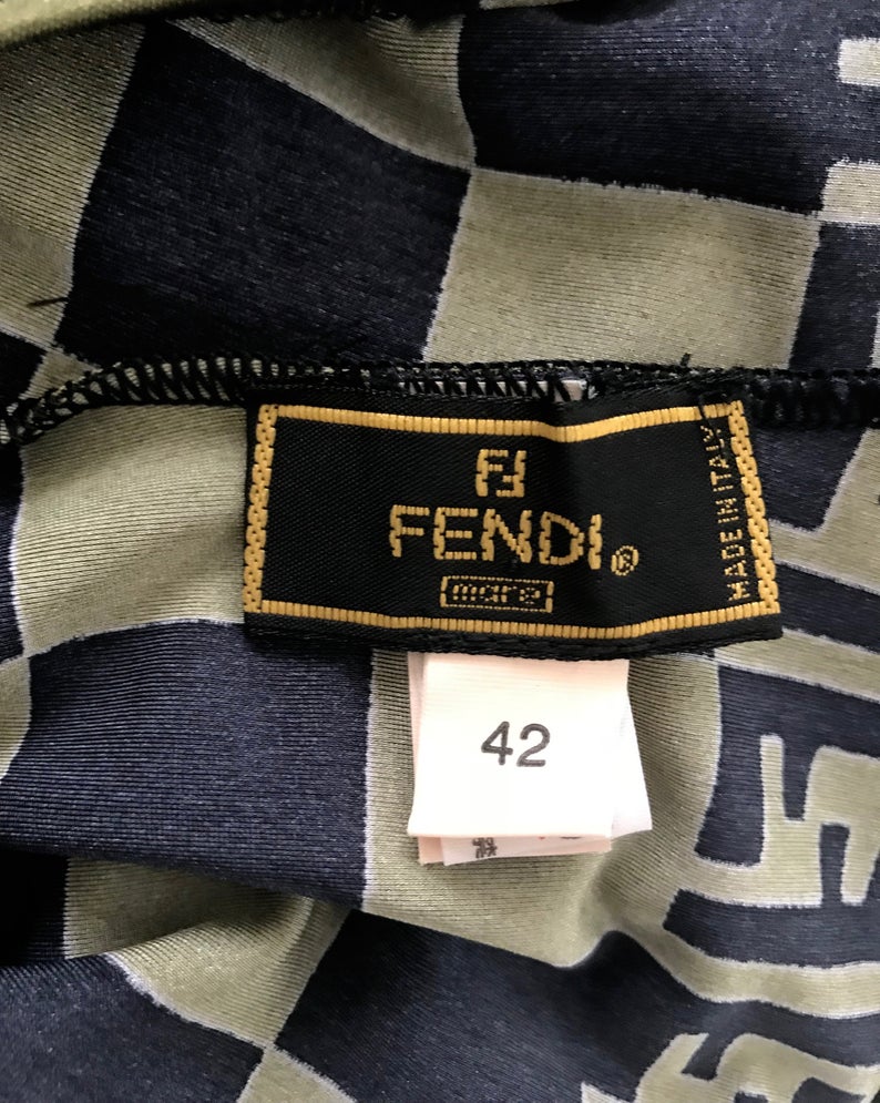 FRUIT vintage Mint condition Fendi Zucca print swimsuit from the 90s. This amazing monogram logo set is a collectors dream. Features a lingerie style bra top with the iconic Fendi logo monogram and Fendi checkerboard print design. This would also make an incredible bodysuit for day wear.