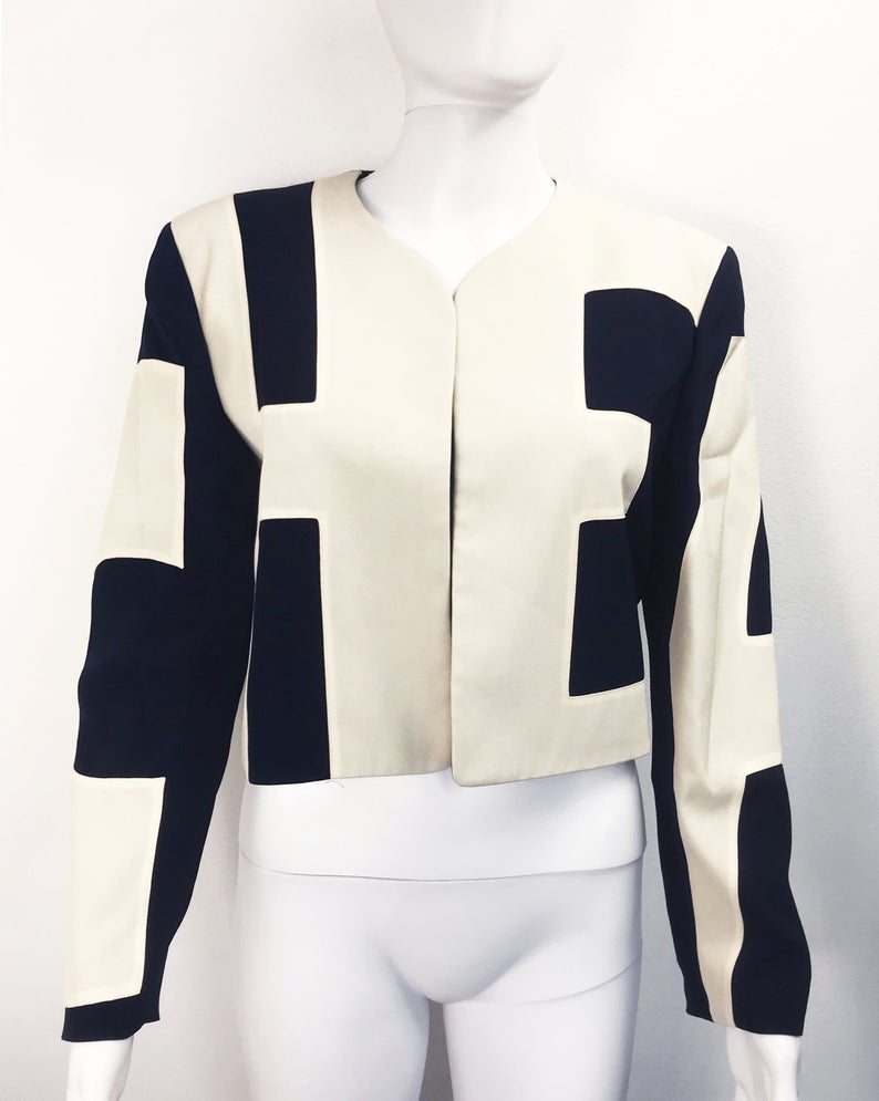 FRUIT Vintage rare and collectable Moschino Cheap & Chic logo slogan jacket dating to the 1990s. Cut for a cropped, boxy fit, it features a large, graphic, block letter design of the words 'CHEAP' with 'and Chic' embroidered at the rear.