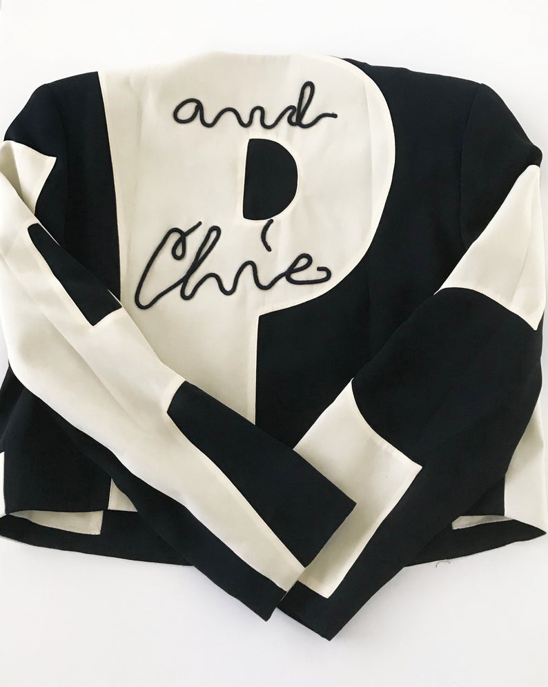 FRUIT Vintage rare and collectable Moschino Cheap & Chic logo slogan jacket dating to the 1990s. Cut for a cropped, boxy fit, it features a large, graphic, block letter design of the words 'CHEAP' with 'and Chic' embroidered at the rear.