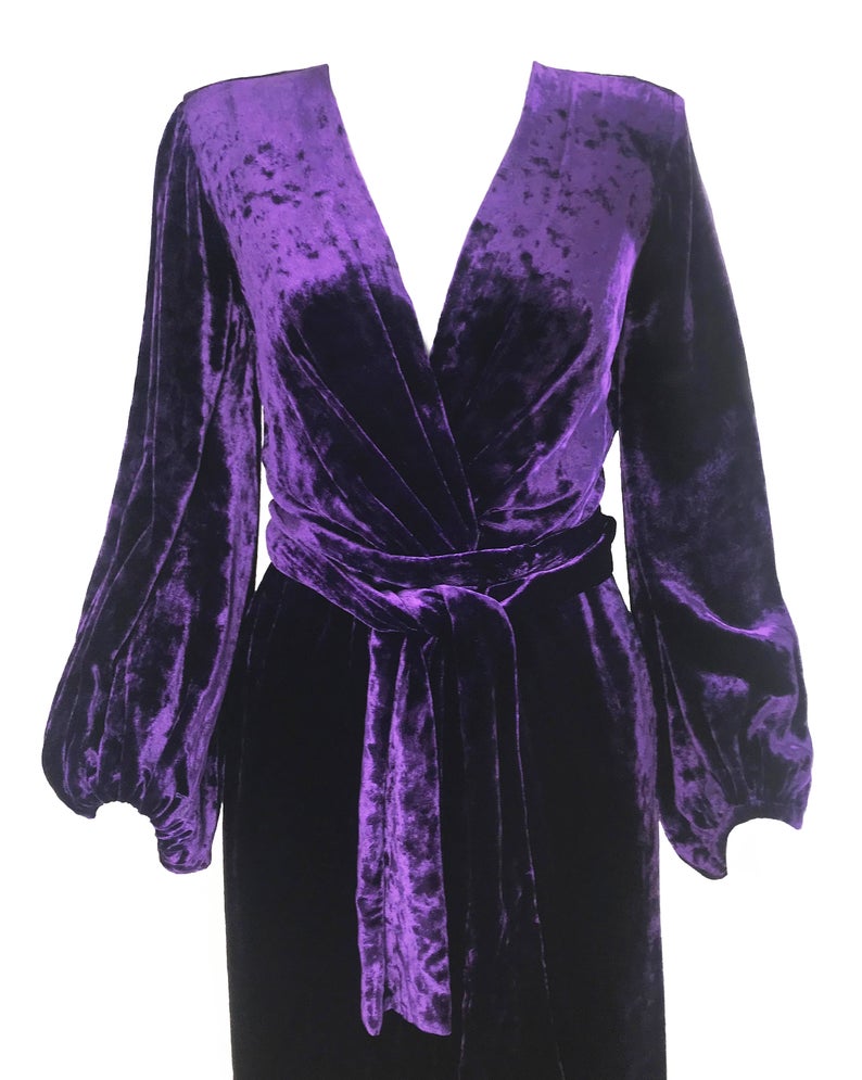 FRUIT Vintage Yves Saint Laurent Rive Gauche purple velvet gown dating to the 1970s. YSL dress features a plunging neckline, gorgeous 70s bell sleeves and removable wrap tie belt. It can be worn as a dress or unclipped and worn as a duster jacket/robe.