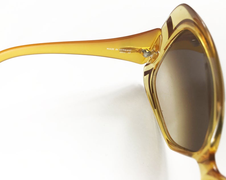 Fruit Vintage Christian Dior yellow 1970s oversize logo sunglasses in excellent condition. They feature Dior CD logos on each arm and brown gradient lenses.
