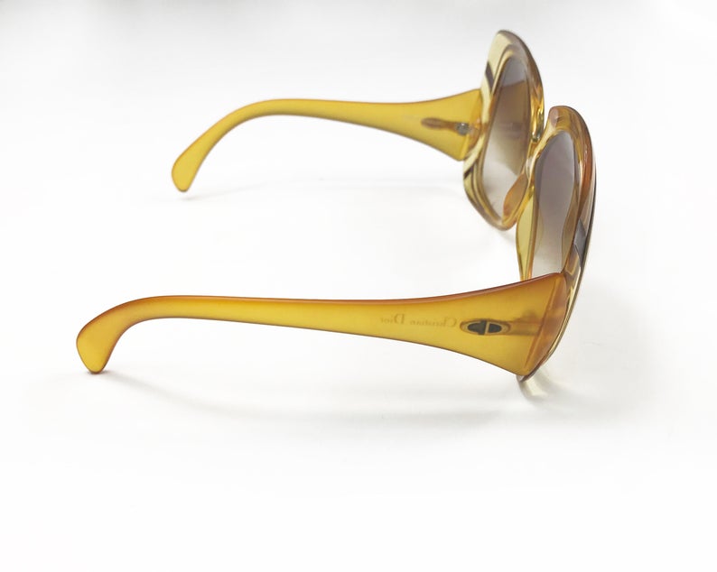 Fruit Vintage Christian Dior yellow 1970s oversize logo sunglasses in excellent condition. They feature Dior CD logos on each arm and brown gradient lenses.