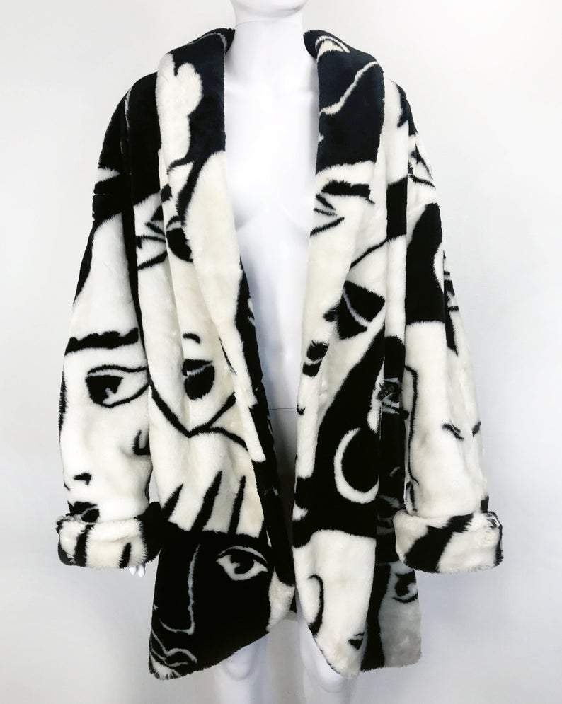 Fruit Vintage Donnybrook Faces Coat. Original 1980s Faux Fur cocoon coat with a relaxed, oversized silhouette. Features bold beige/black graphic custom Donnybrook face print.