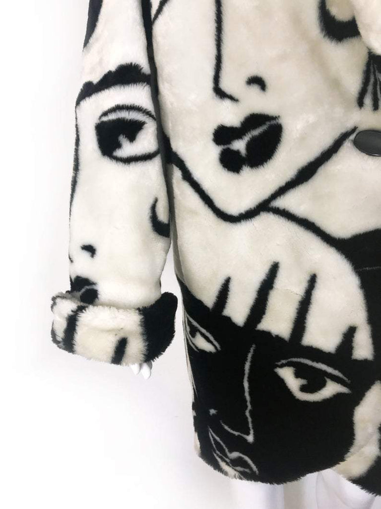 Fruit Vintage Donnybrook Faces Coat. Original 1980s Faux Fur cocoon coat with a relaxed, oversized silhouette. Features bold beige/black graphic custom Donnybrook face print.