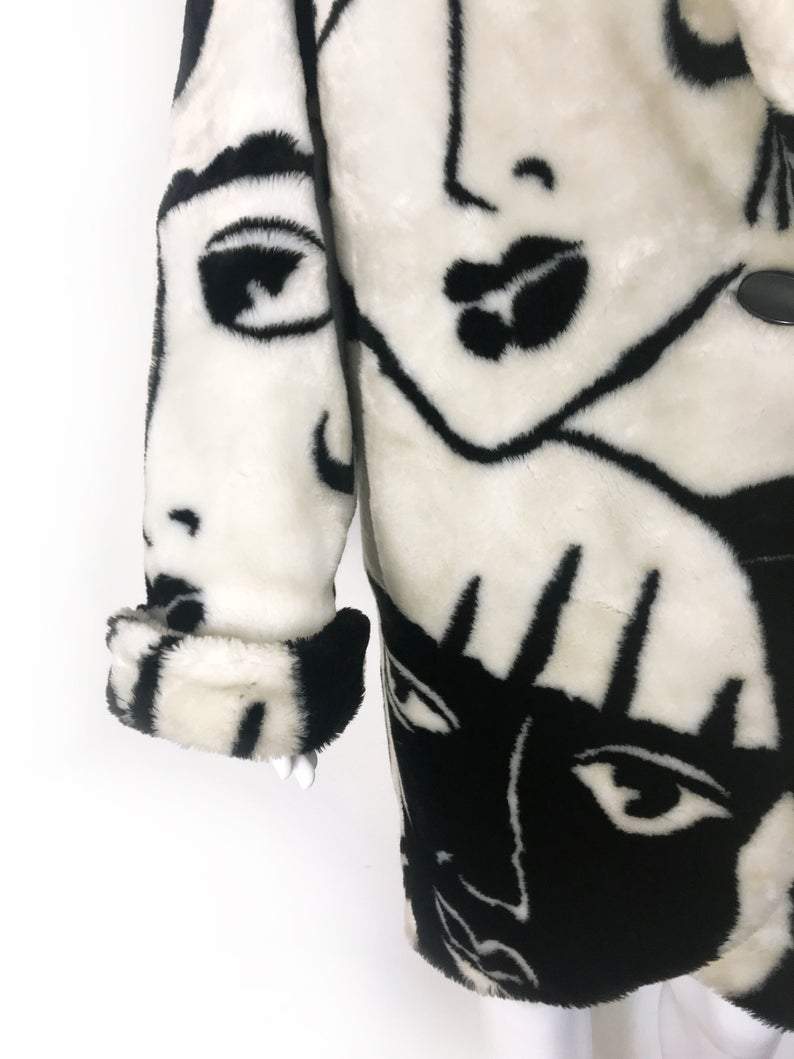Fruit Vintage Donnybrook Faces Coat. Original 1980s Faux Fur cocoon coat with a relaxed, oversized silhouette. Features bold beige/black graphic custom Donnybrook face print.