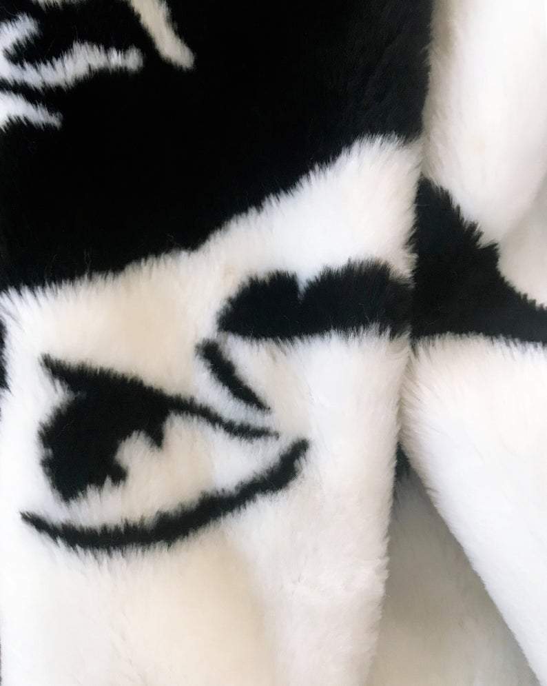 Fruit Vintage Donnybrook Faces Coat. Original 1980s Faux Fur cocoon coat with a relaxed, oversized silhouette. Features bold beige/black graphic custom Donnybrook face print.